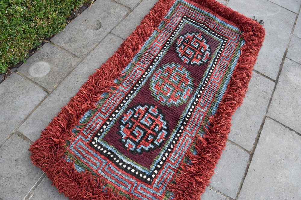 A very rare purple ground monastic seating mat from the Wangden valley in Tibet View II