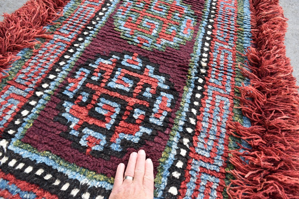 A very rare purple ground monastic seating mat from the Wangden valley in Tibet View III