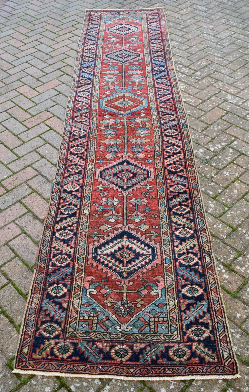 An antique narrow Heriz runner 354x78cm