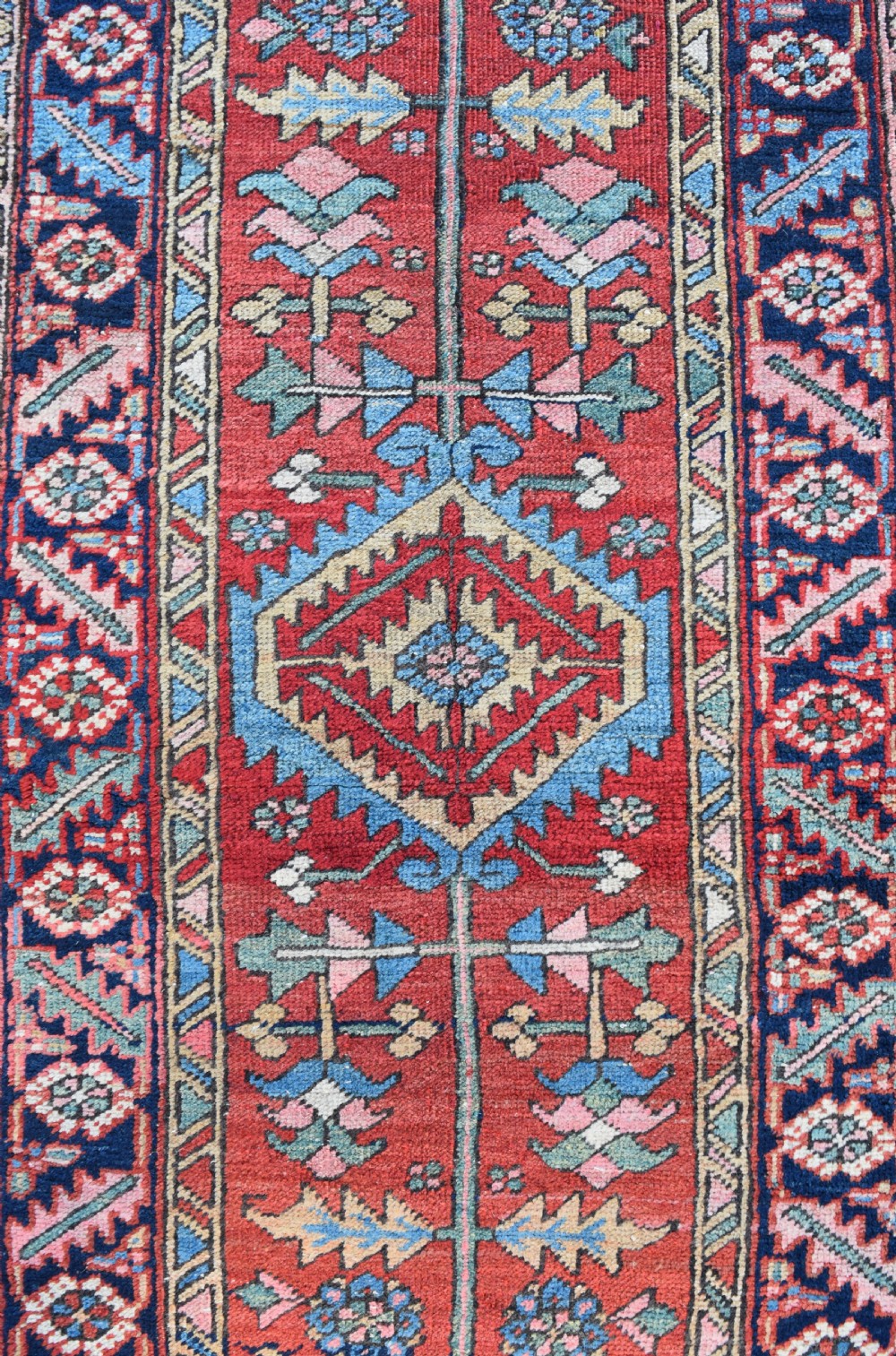 An antique narrow Heriz runner 354x78cm View II