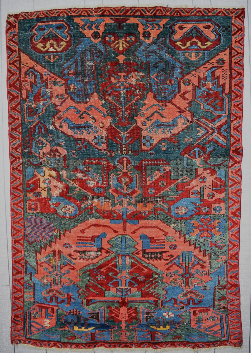 A rare Cacuasian Seychor dragon rug on green ground 153x103 cm