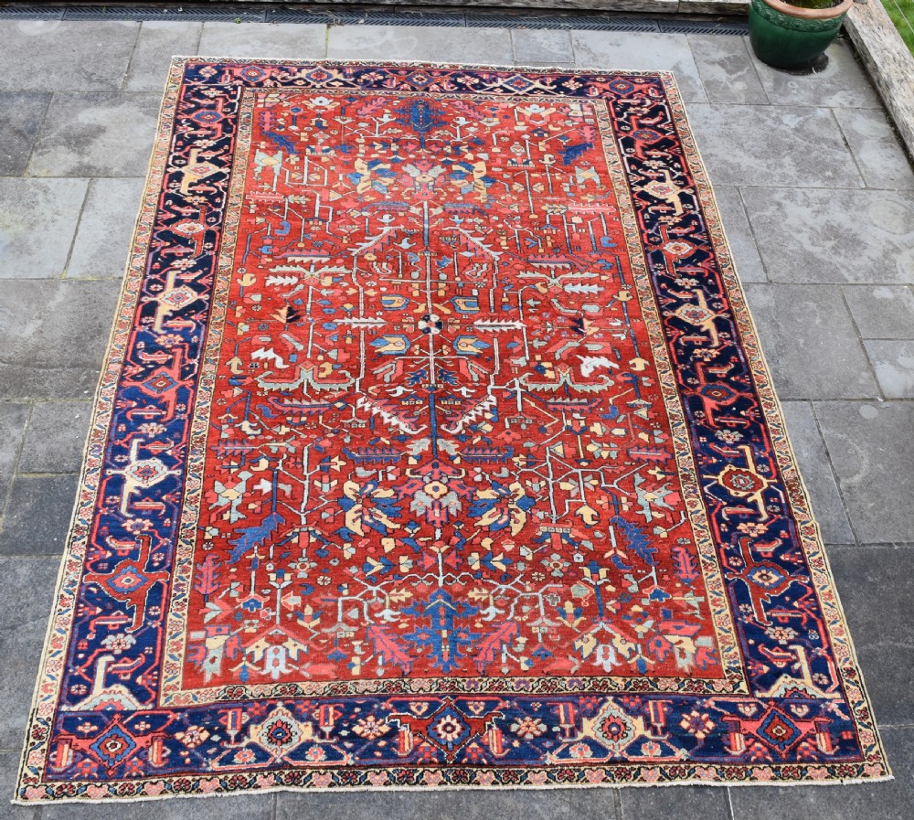 An Antique Heriz roomsize carpet 350x240 cm