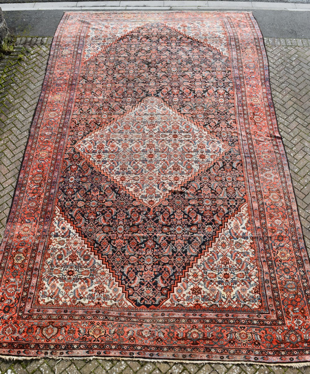 A very large antique Ferahan carpet 646x379cm