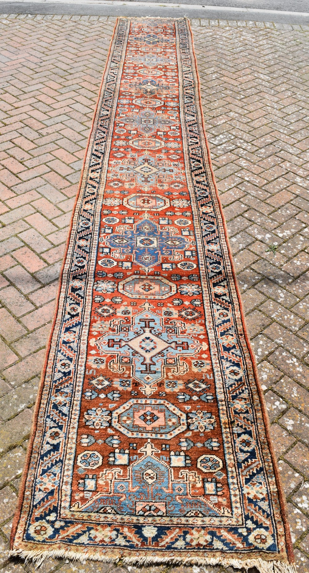 An antique Heriz runner of long narrow proportions 530x80 cm