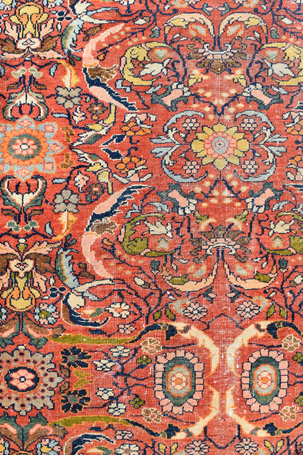 An oversized antique Persian Mahal wool carpet with a floral arabesque pattern on a terracotta field and a dark navy border. View II