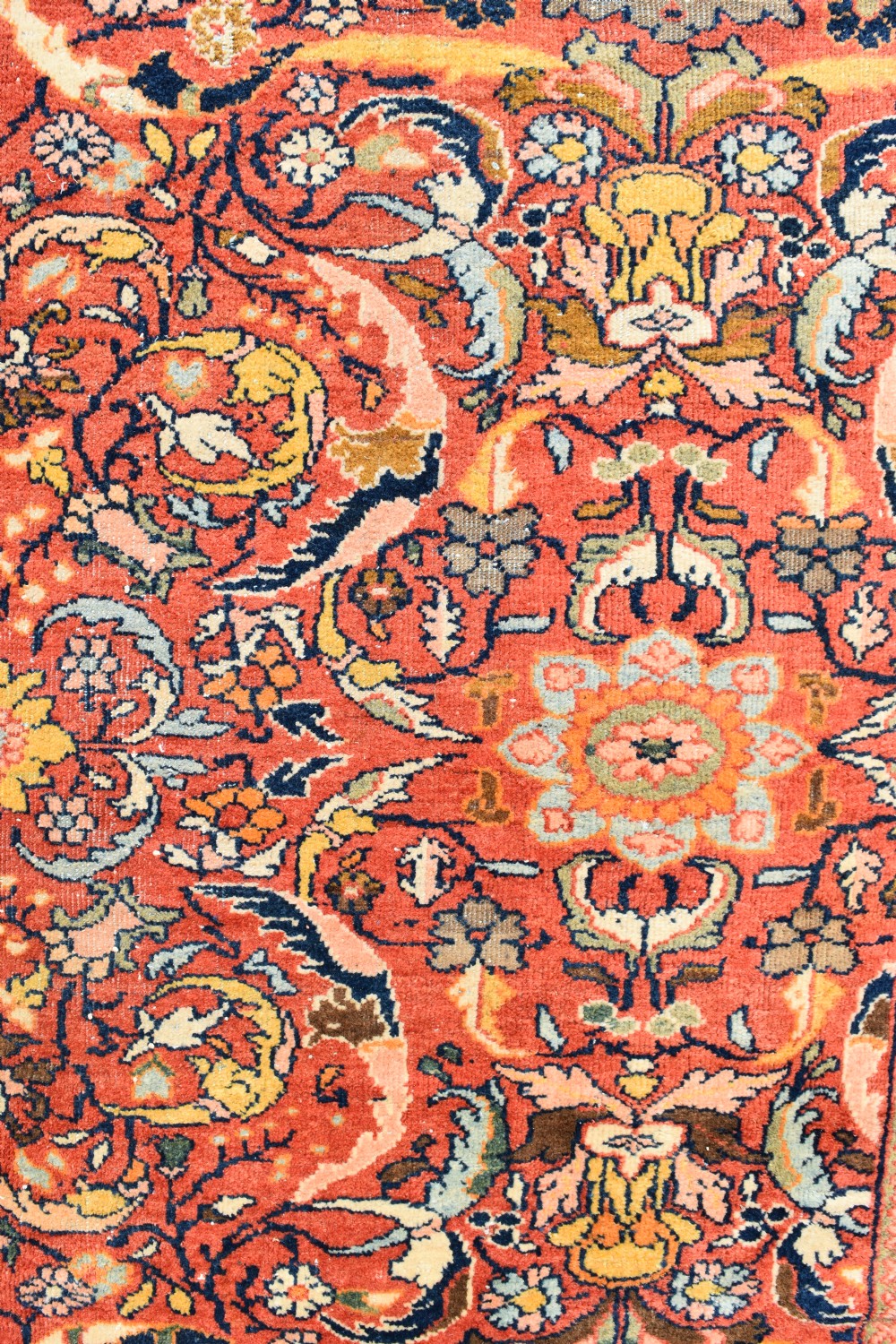 An oversized antique Persian Mahal wool carpet with a floral arabesque pattern on a terracotta field and a dark navy border. View VII