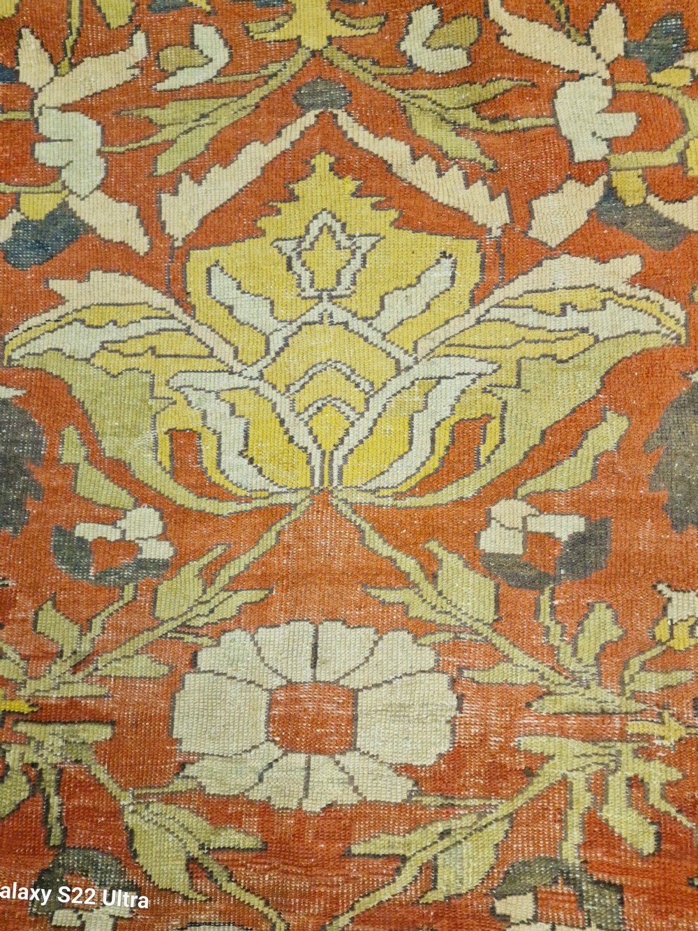 A large antique Persian Sultanabad hand-knotted wool carpet with large botanical palmettes on a terracotta field enclosed by multi-band borders. View XIII