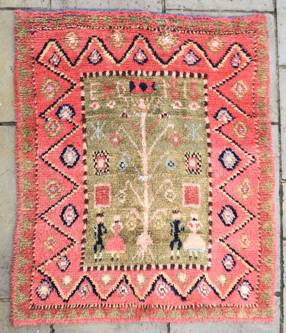 An early Finnish Rya wedding rug dated 1815
