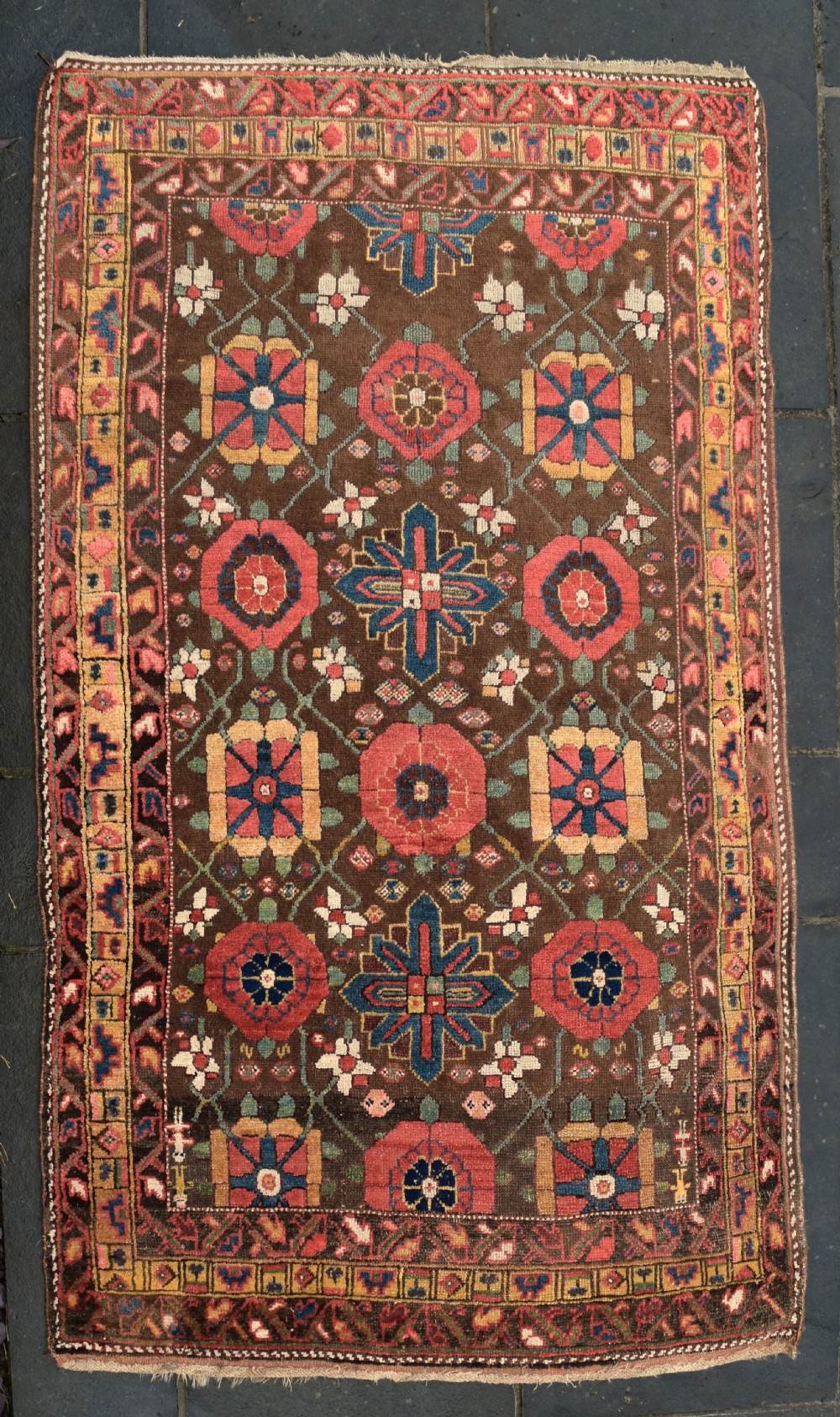 An antique Kurdish tribal rug 232x133 cm