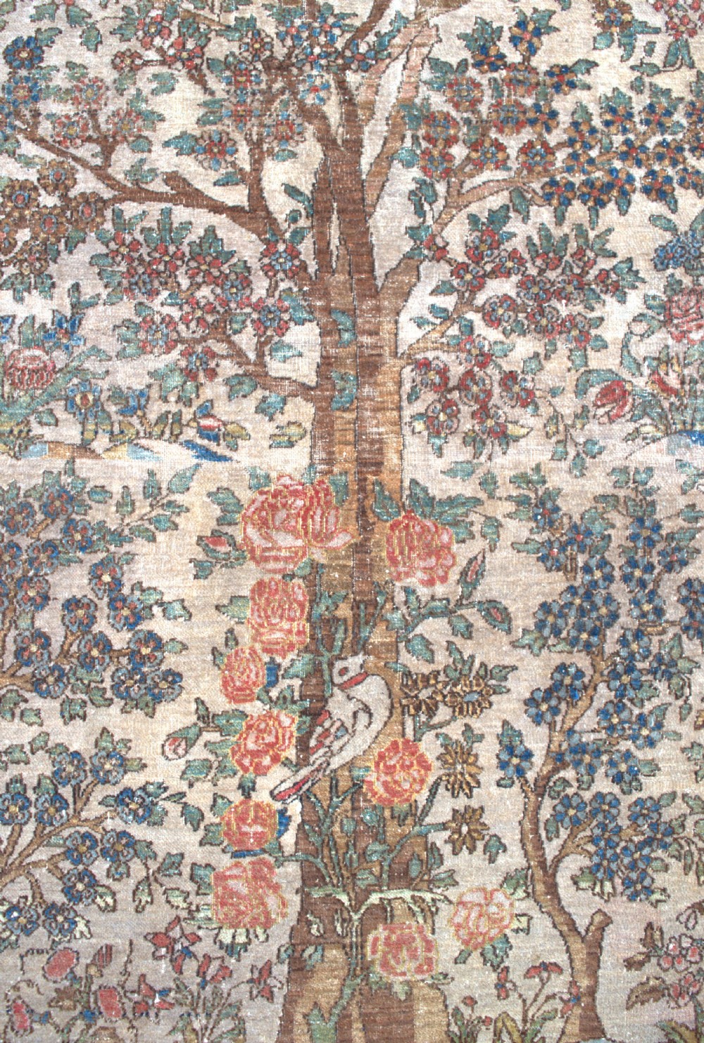 An antique Persian Isfahan wool rug featuring a central Tree of Life pictorial motif with birds framed by a terracotta floral border. View II