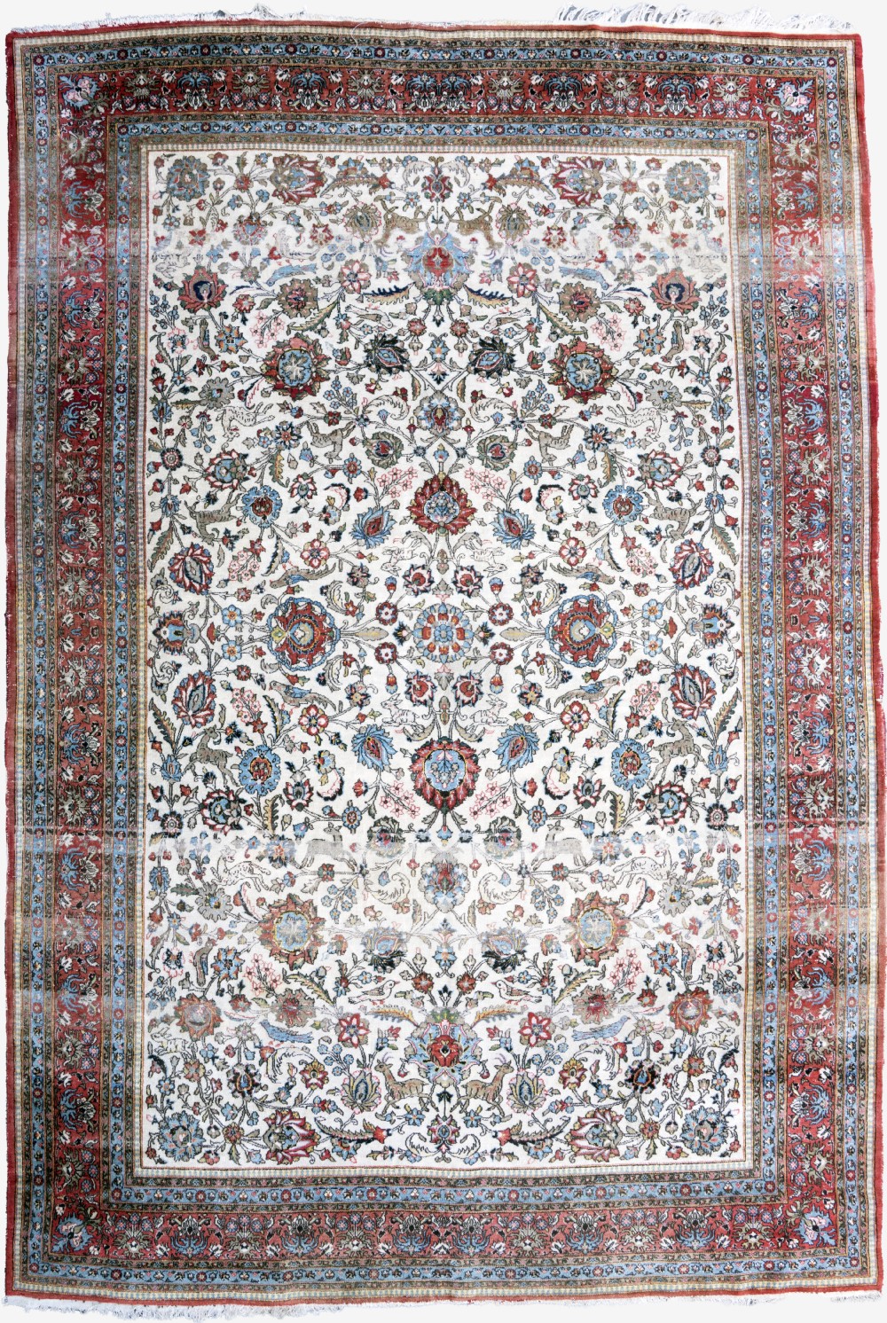 A large hand-knotted Persian Qum carpet featuring an ivory central field densely patterned with floral and animal motifs framed by a red border.