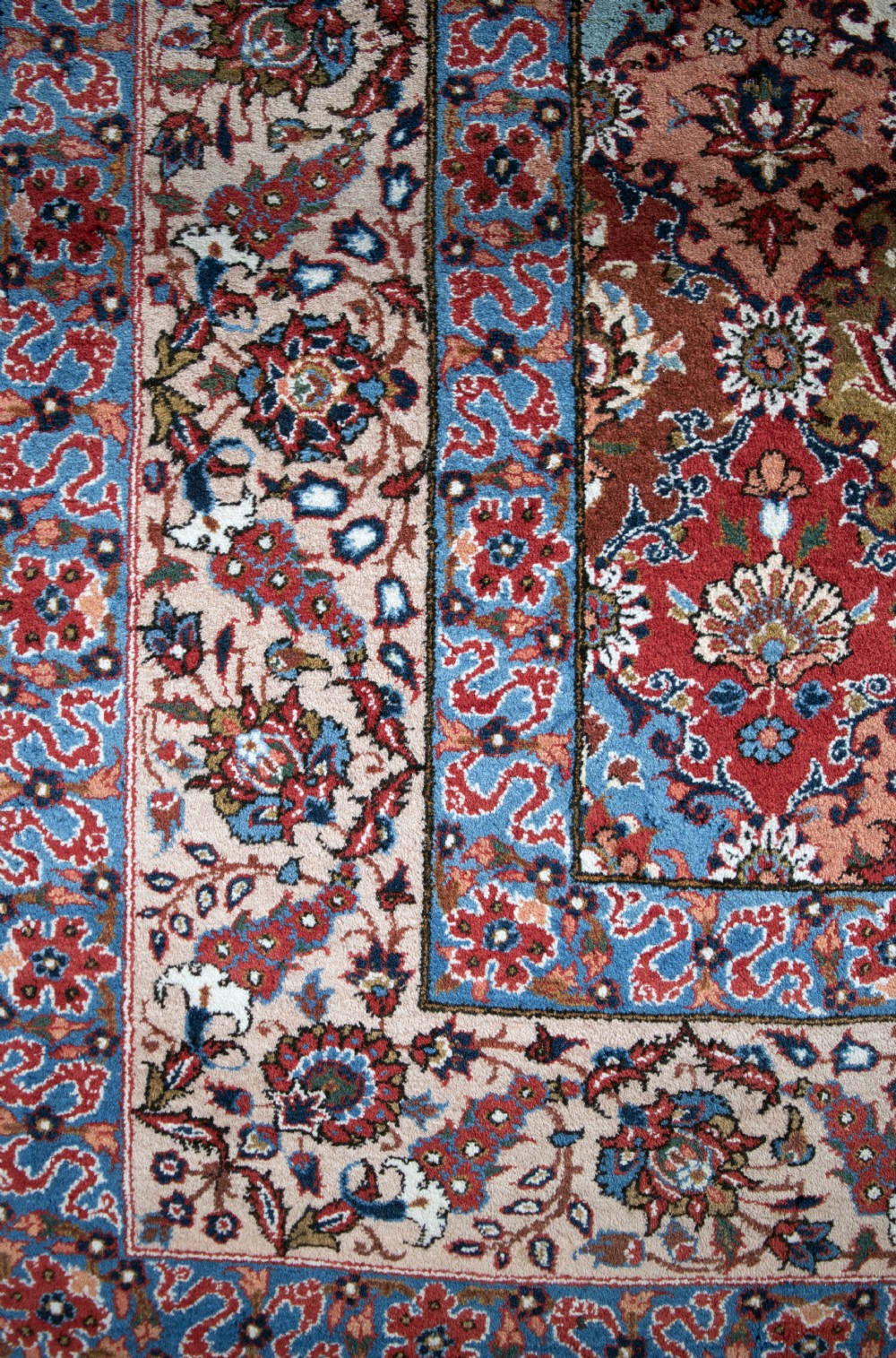 A large hand-knotted antique Persian Tabriz carpet displaying an intricate diamond lattice floral pattern in red, blue, and cream tones. View II