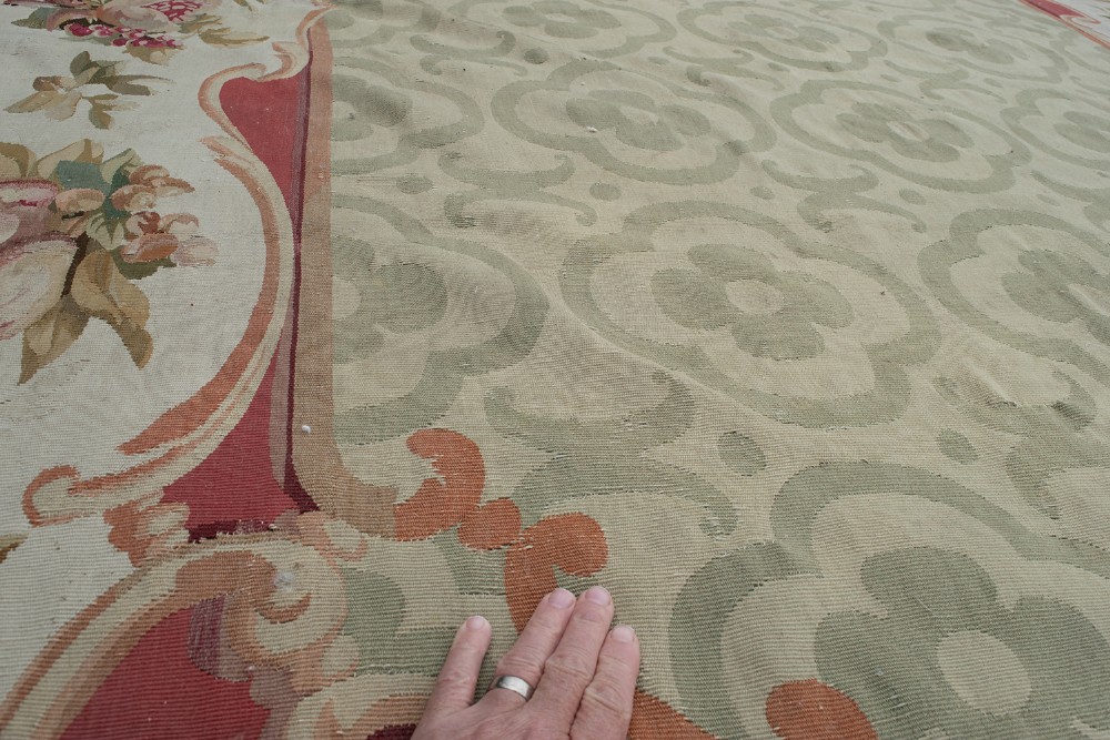 An antique French Aubusson flat-weave carpet featuring a central sage green geometric field framed by a rich floral cartouche border and a solid burgundy outer rim. View V