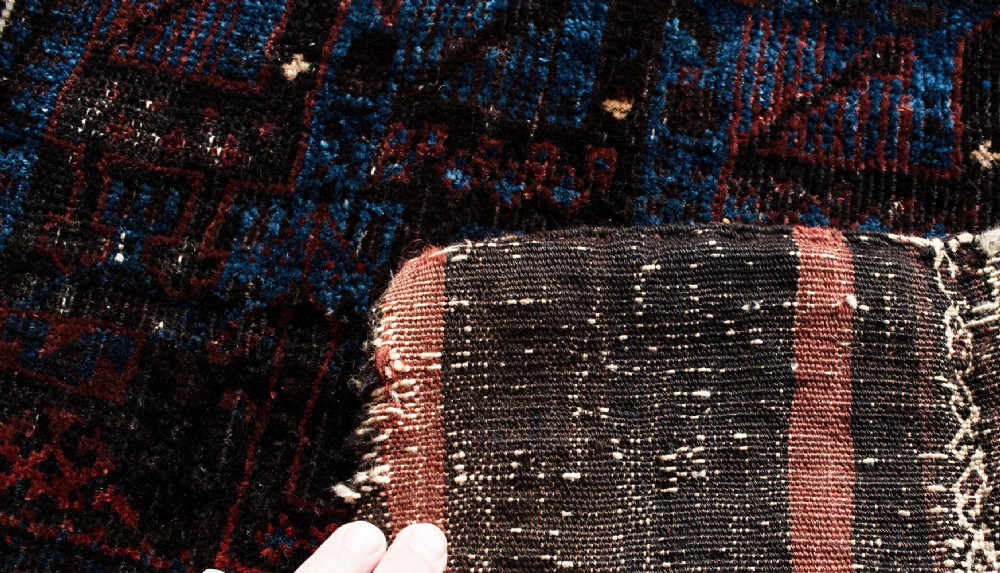 An antique square handwoven Baluch wool bag face featuring rows of stylised terracotta and blue bird motifs on a dark brown ground framed by a white geometric border. View III