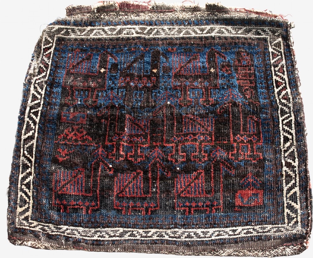 An antique square handwoven Baluch wool bag face featuring rows of stylised terracotta and blue bird motifs on a dark brown ground framed by a white geometric border. View IV