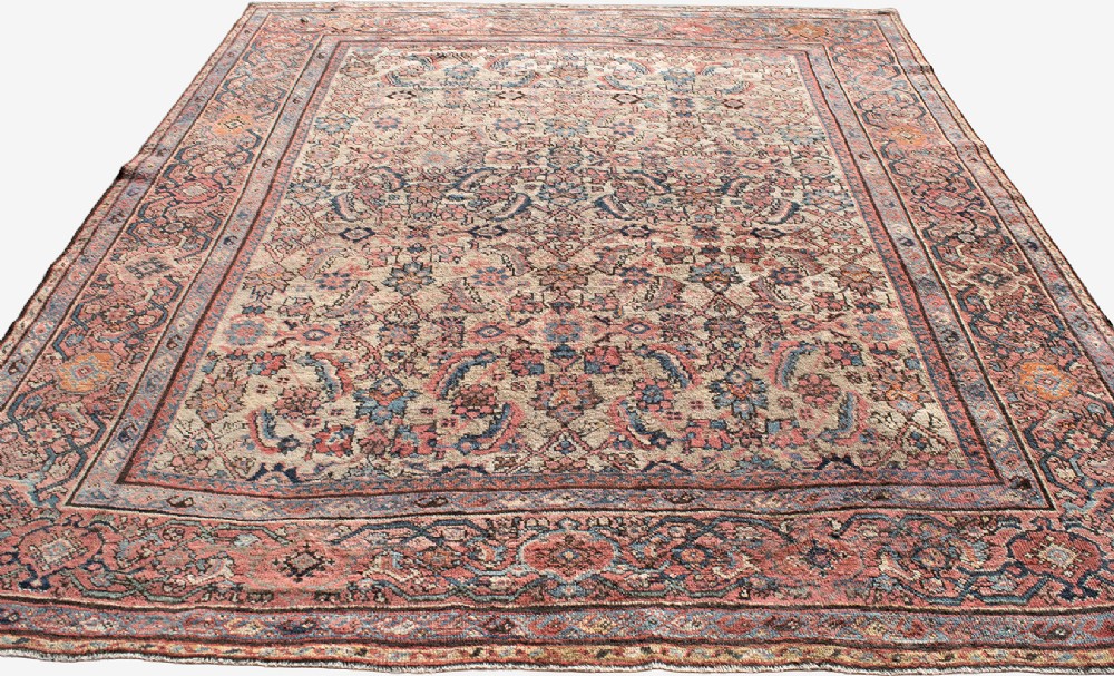 An antique Persian Ferahan wool carpet featuring a dense floral pattern on a cream field surrounded by a terracotta multi-banded border. View IV