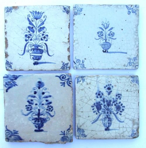 Four 18th Century Delft Blue & White Tiles Painted with Flowers