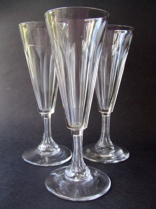 A Set of Three Georgian Cut Glass Flutes