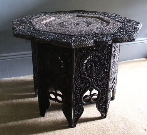 Indian Hardwood Table Carved with Peacocks and Serpents and Inset with a Pierced Copper Top