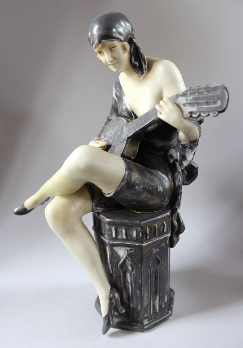 Royal Dux Figure of an Art Deco Girl Playing the Banjo
