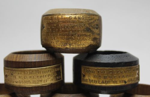 fig 1. Six Teak Napkin Rings of Naval Interest