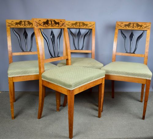 fig 1. Set of four Biedermeier inlaid satinwood dining chairs with lion decoration