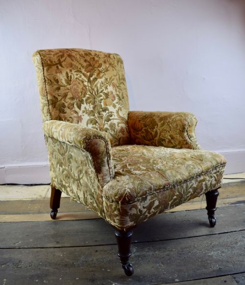 An Antique Library Armchair with Tapestry Upholstery