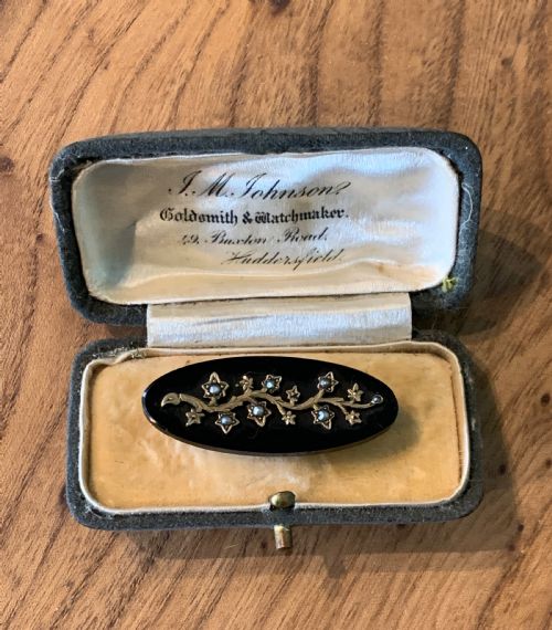Victorian Onyx Brooch with a Seed Pearl Set Gold Branch