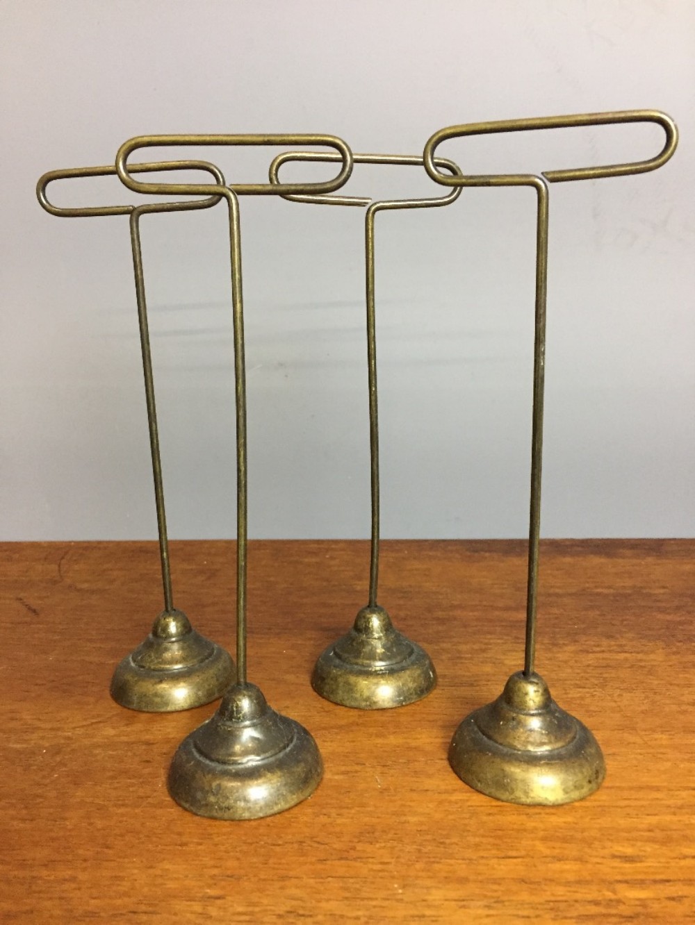 Set of Four Edwardian Bronze Patinated Steel Shop Display Stands