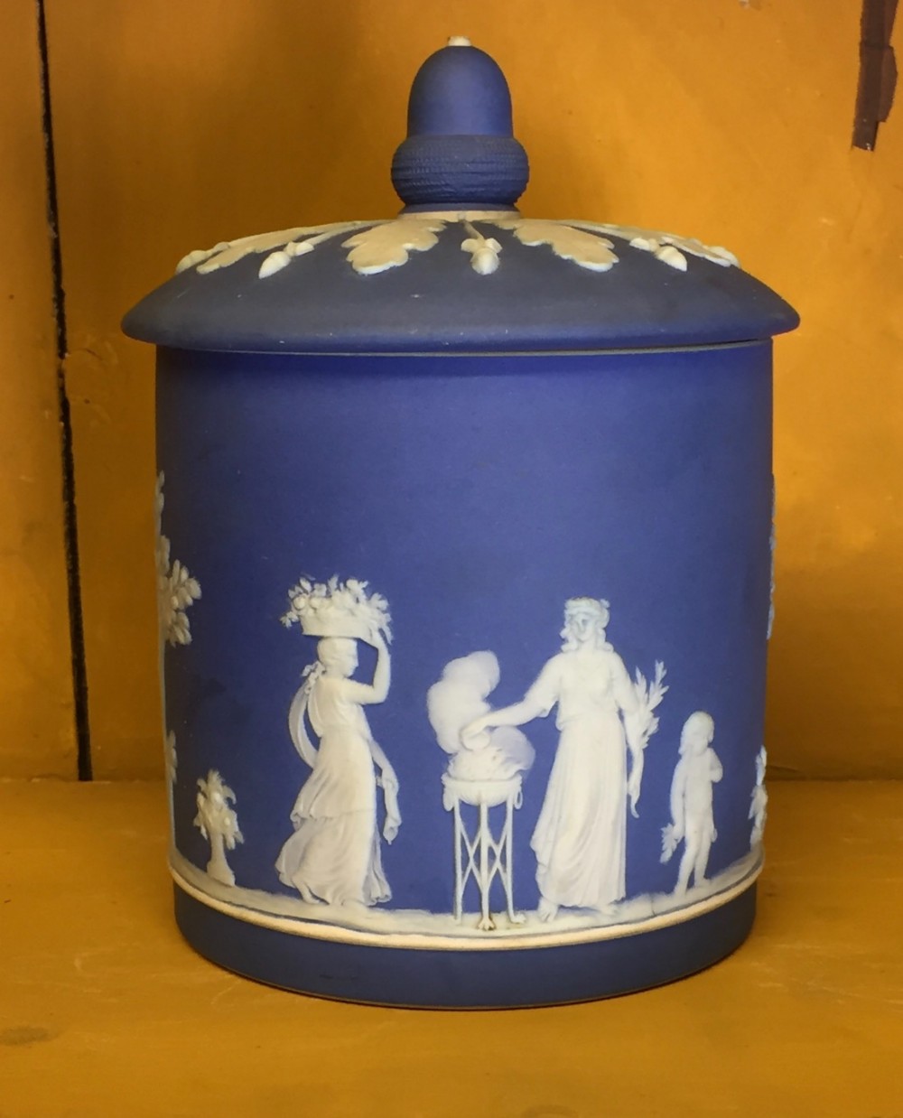 Wedgwood blue jasper dip jar and cover with classical figures making offerings beside a sacrificial altar