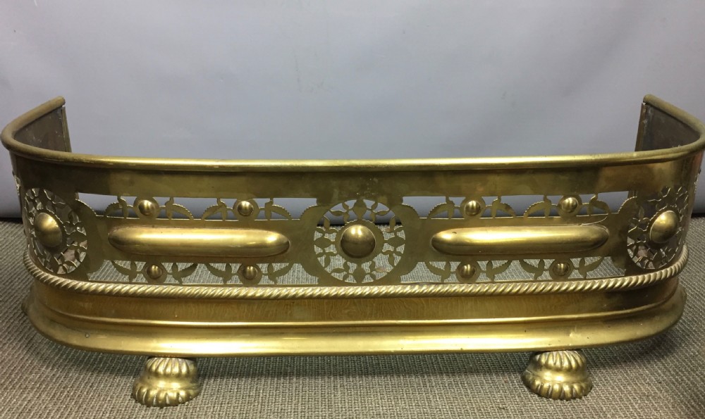 Small Pierced Brass Fireside Fender with lions paw feet View II