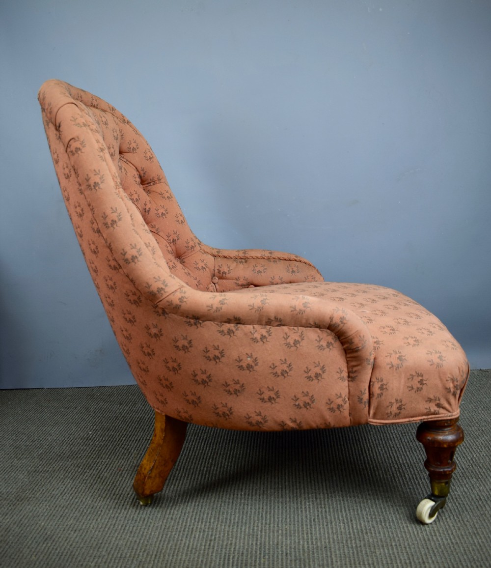 Antique button back armchair of small proportions with Cope & Collinson castors View II