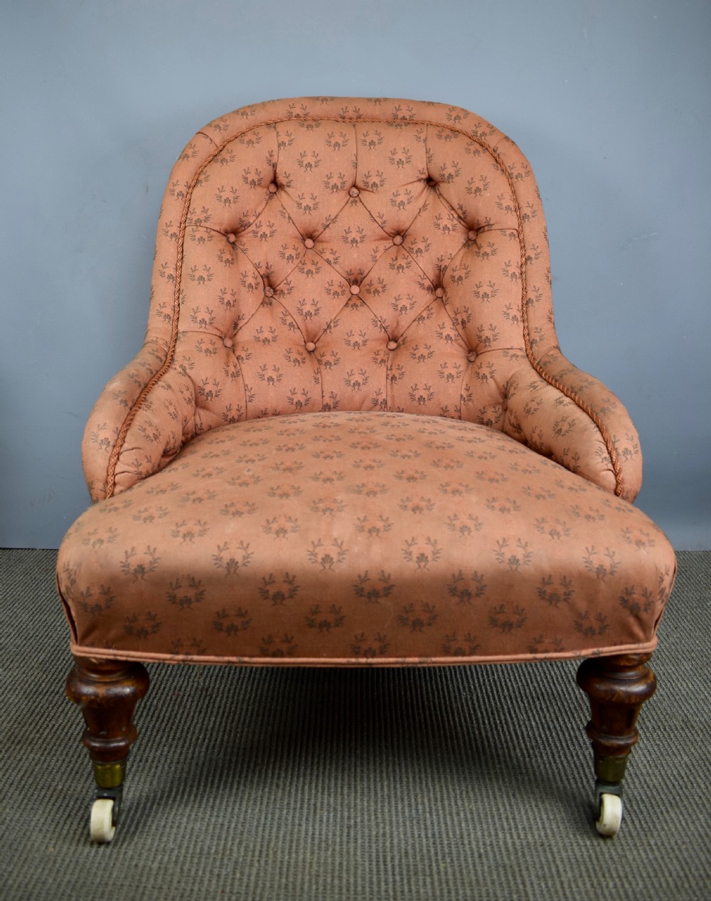 Antique button back armchair of small proportions with Cope & Collinson castors View III