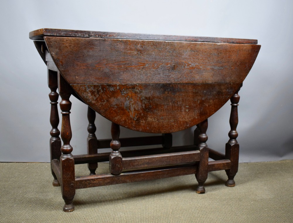 George I Oak gateleg drop flap dining table circa 1700 View II