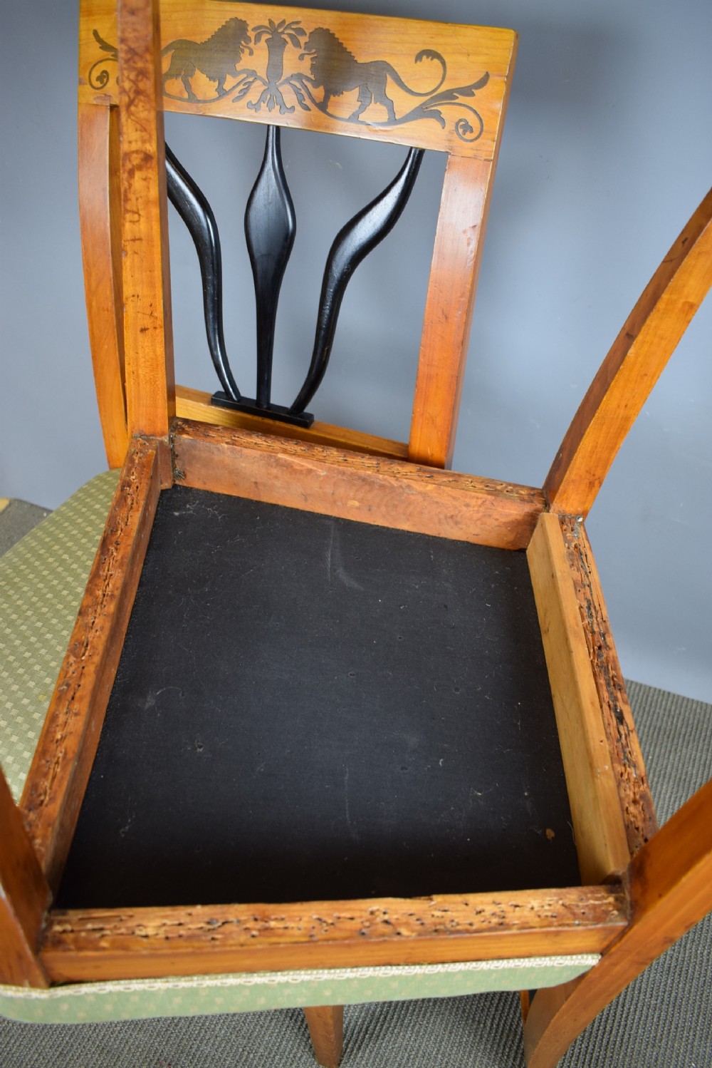 Set of four Biedermeier inlaid satinwood dining chairs with lion decoration View VIII