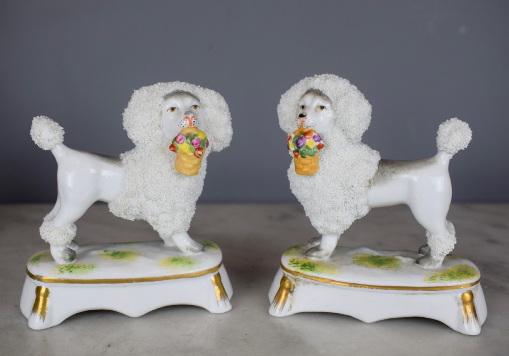 Pair of French Samson porcelain poodles carrying baskets in their mouths