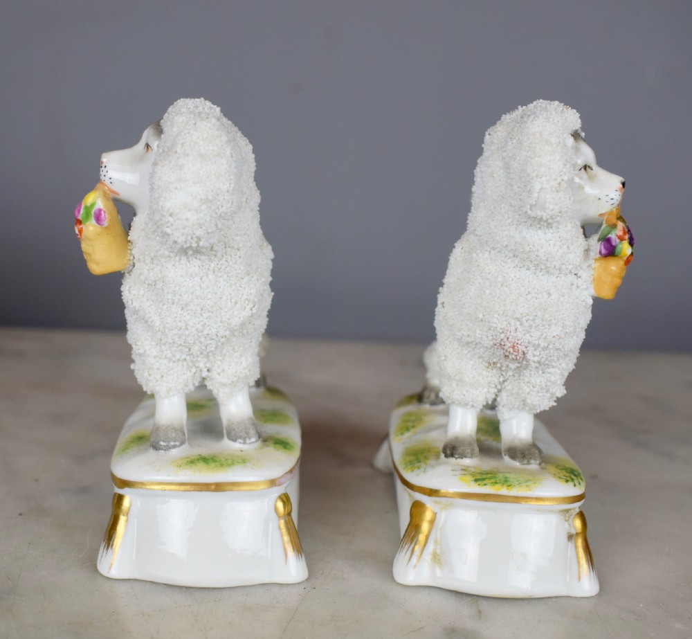 Pair of French Samson porcelain poodles carrying baskets in their mouths View III