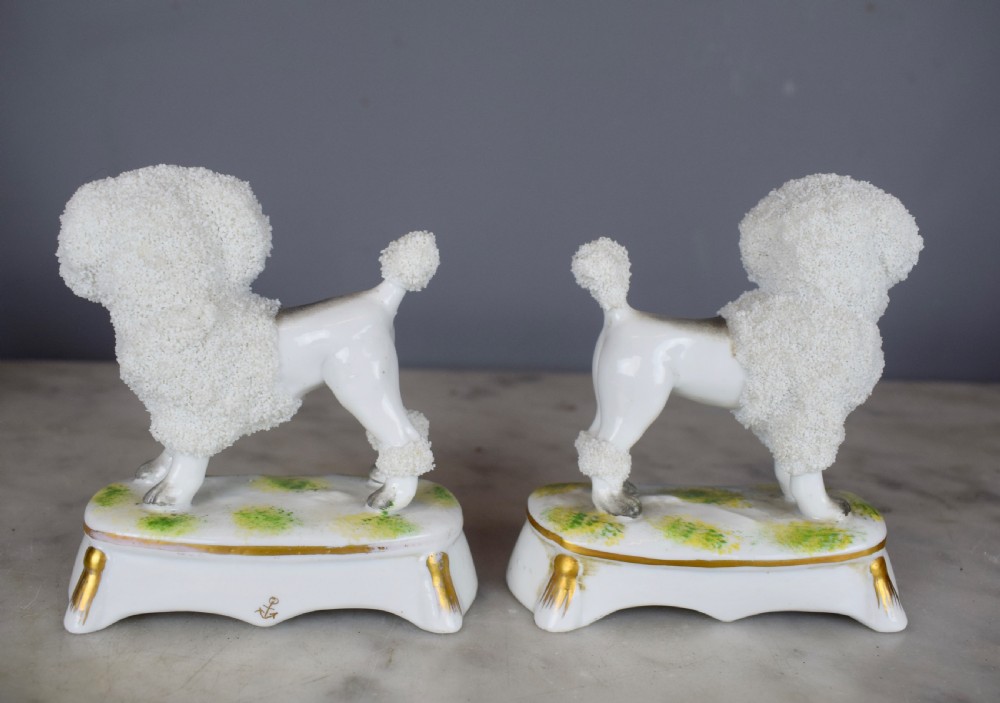 Pair of French Samson porcelain poodles carrying baskets in their mouths View IV