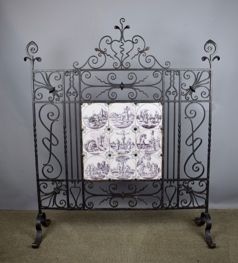 Wrought iron fire screen inset with 18th century manganese Delft tiles