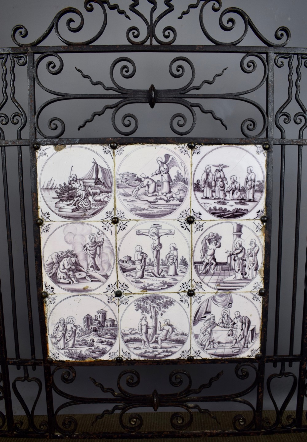 Wrought iron fire screen inset with 18th century manganese Delft tiles View IV