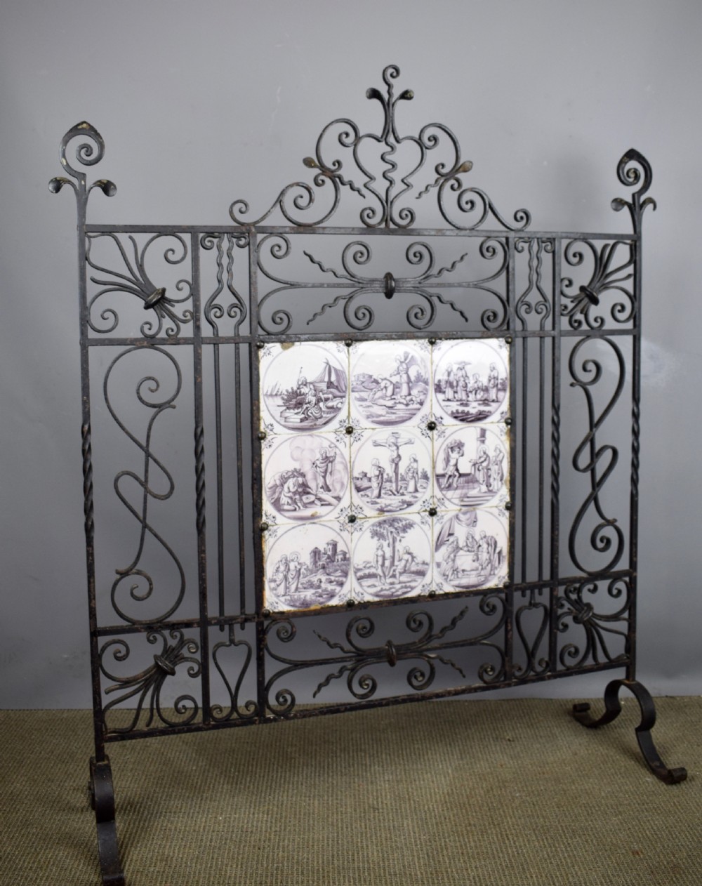 Wrought iron fire screen inset with 18th century manganese Delft tiles View VI