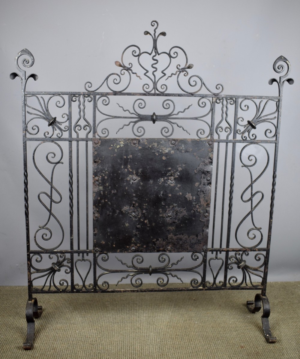 Wrought iron fire screen inset with 18th century manganese Delft tiles View VIII