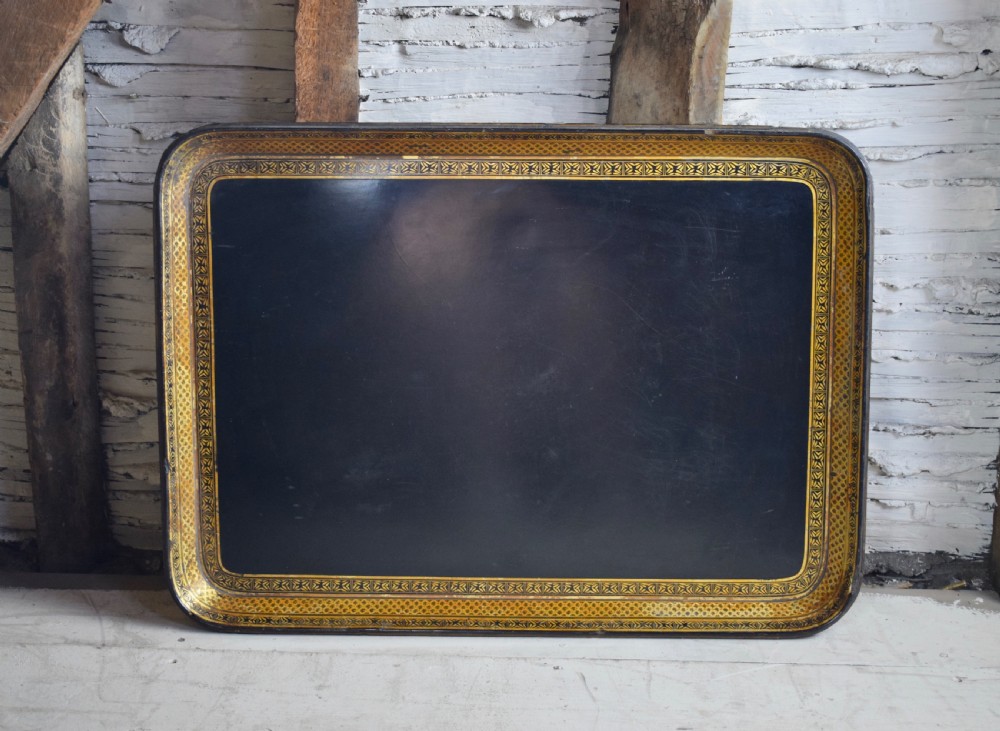 A large good quality Regency paper mâché tray with gilt decoration