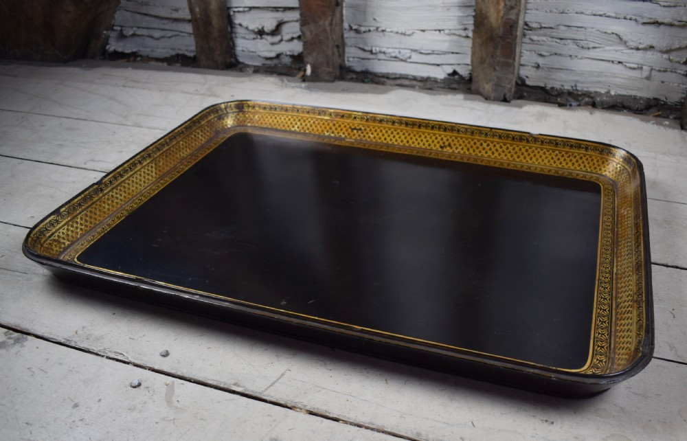 A large good quality Regency paper mâché tray with gilt decoration View V