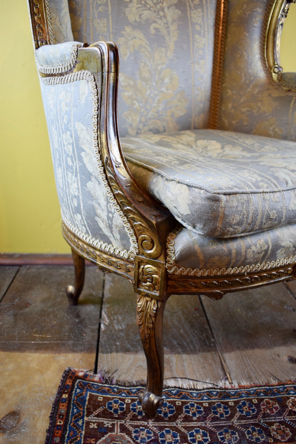 Antique French gilt wood wingback armchair in Louis XVI style View V