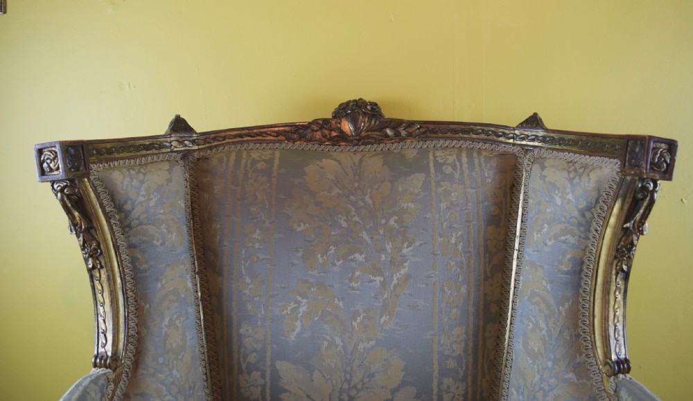 Antique French gilt wood wingback armchair in Louis XVI style View VII
