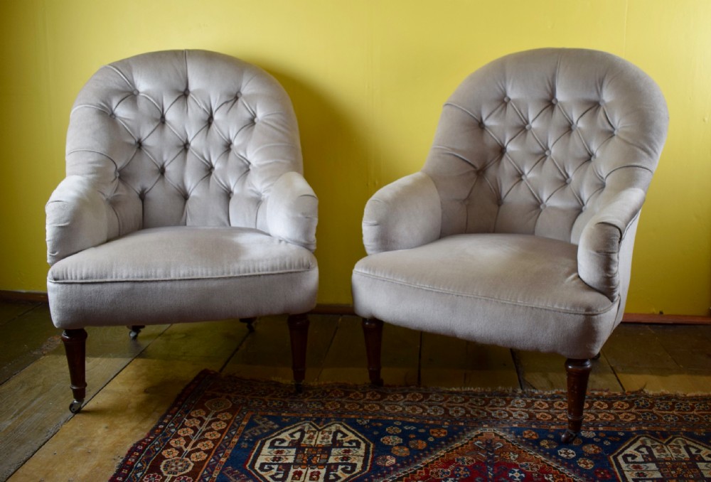 Pair of French button back tub armchairs View II