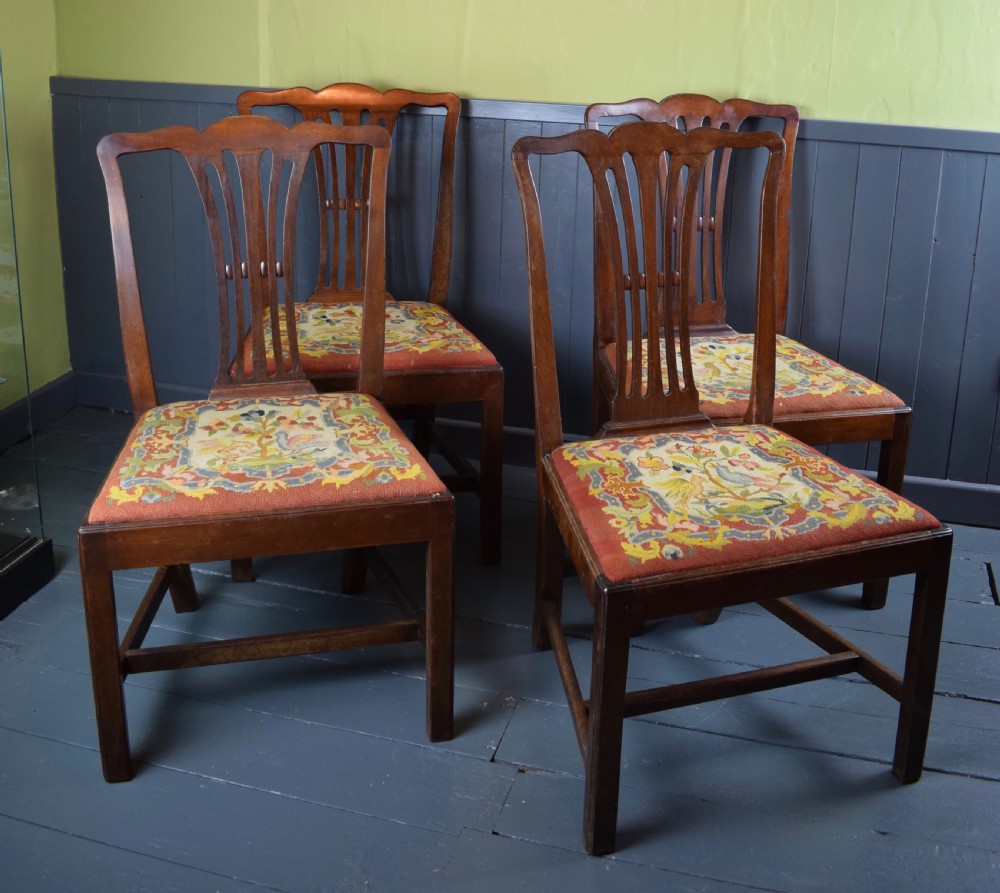 Set of four Georgian mahogany dining chairs with needlework seats View III
