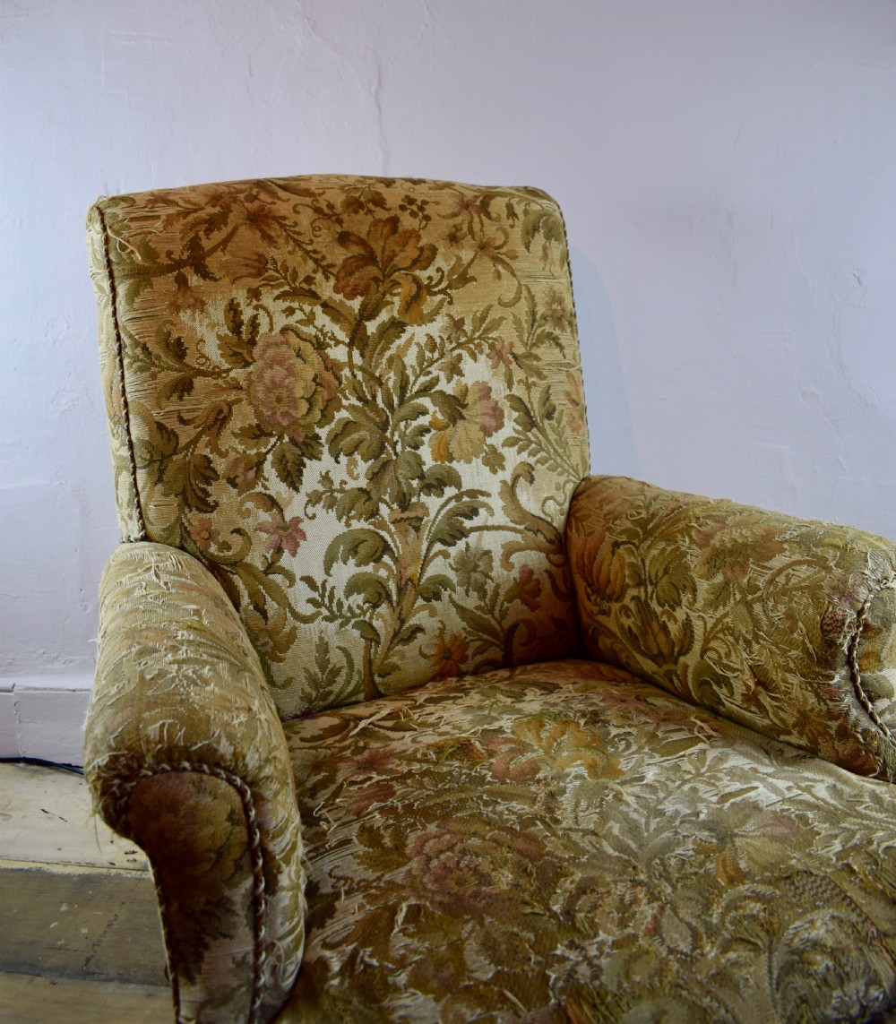 An Antique library armchair with tapestry upholstery View III
