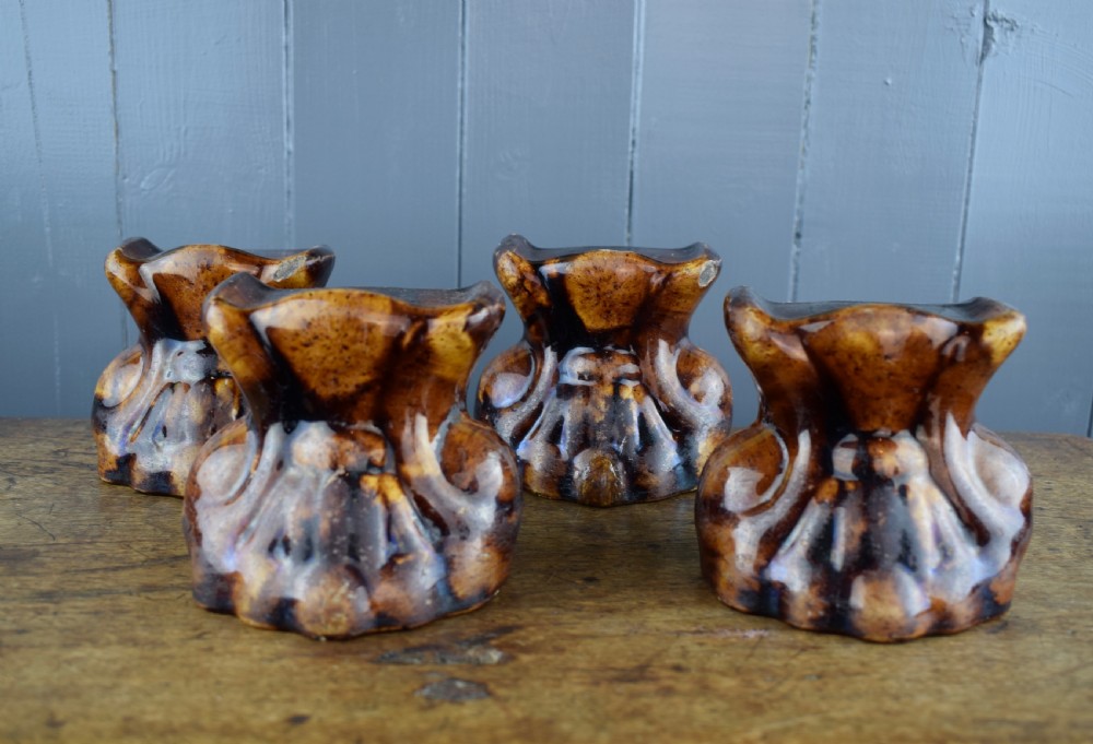 Four Rockingham Treacle Glazed Lion Paw Furniture Supports View IV